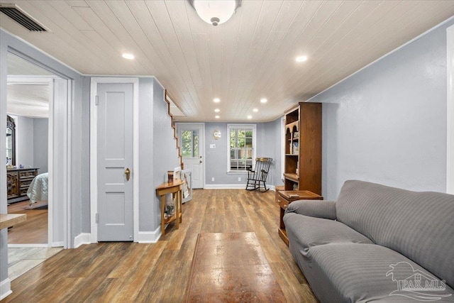 living room featuring hardwood / wood-style floors and wooden ceiling