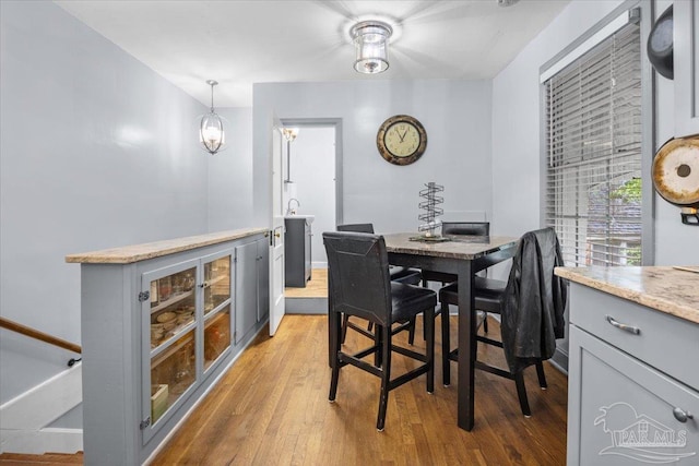 dining space with light hardwood / wood-style flooring