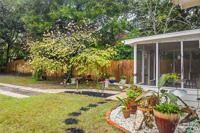 view of yard with a sunroom