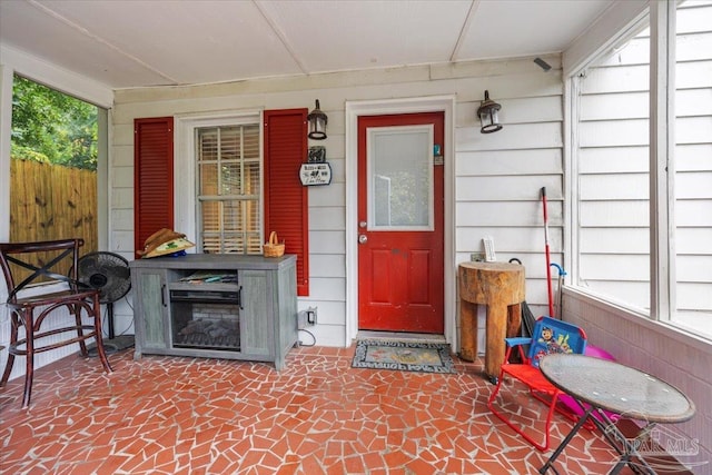 entrance to property featuring covered porch