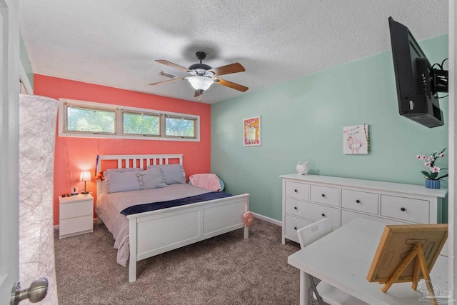 bedroom featuring a textured ceiling, a ceiling fan, and carpet floors