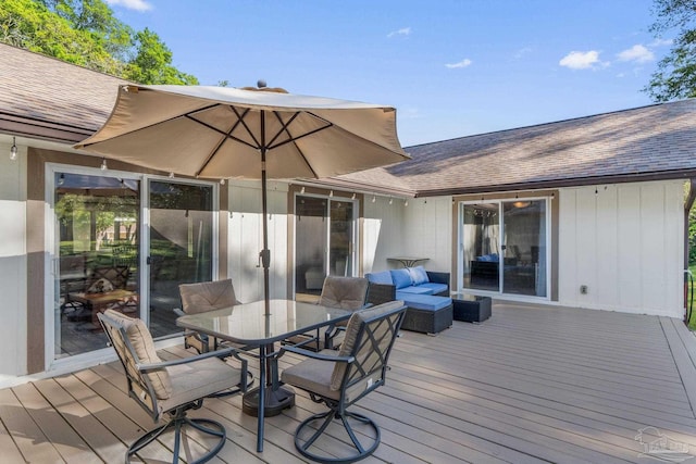 wooden terrace with outdoor dining area
