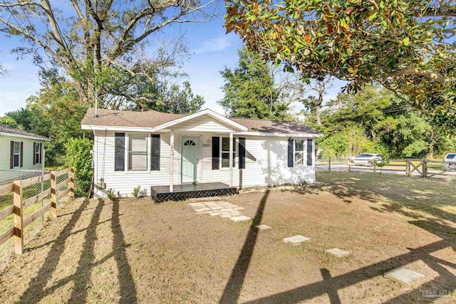 view of front of property with fence private yard and a front yard