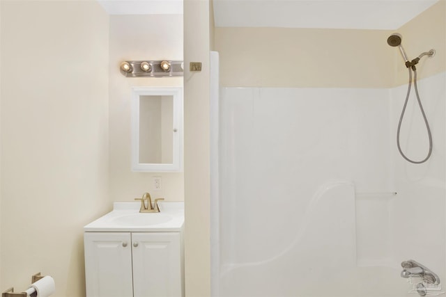 bathroom with a shower and vanity