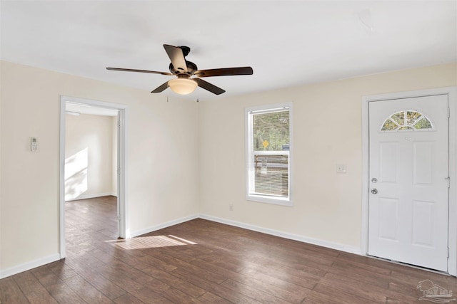 foyer with ceiling fan, baseboards, and dark wood finished floors