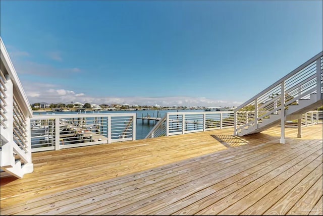 wooden deck featuring a water view