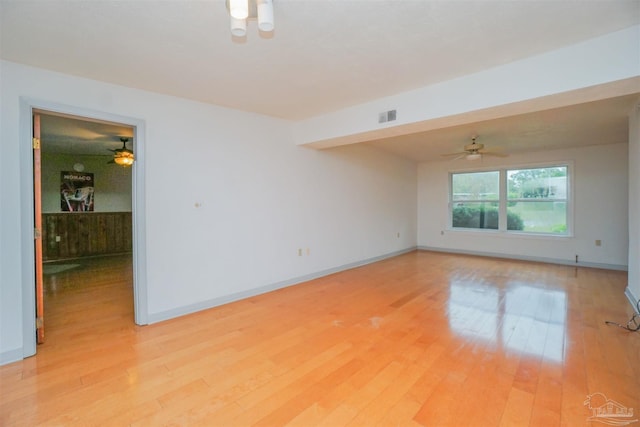 spare room with light hardwood / wood-style flooring