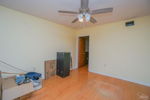 spare room featuring ceiling fan and light wood-type flooring