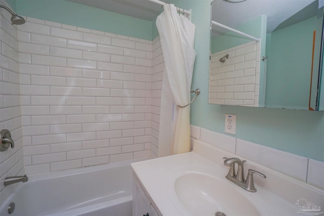 bathroom featuring vanity and shower / tub combo