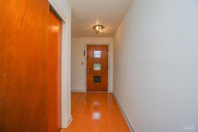 hallway featuring light wood-type flooring