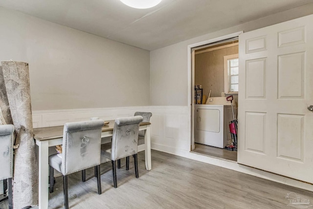 dining area with hardwood / wood-style flooring and washer / clothes dryer