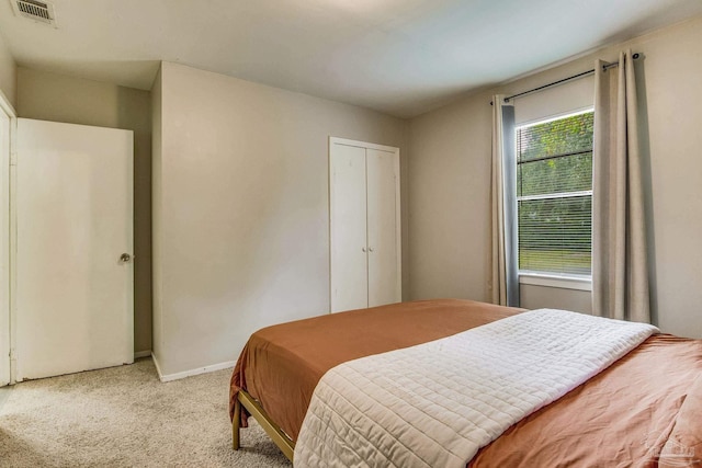 bedroom with light colored carpet