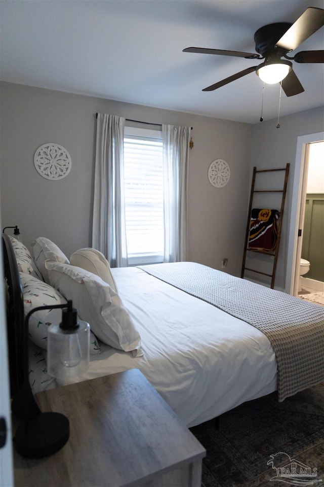 bedroom with connected bathroom and ceiling fan