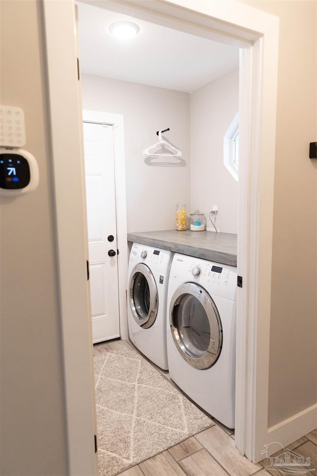 washroom with washing machine and clothes dryer