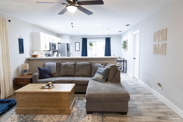 living room with ceiling fan