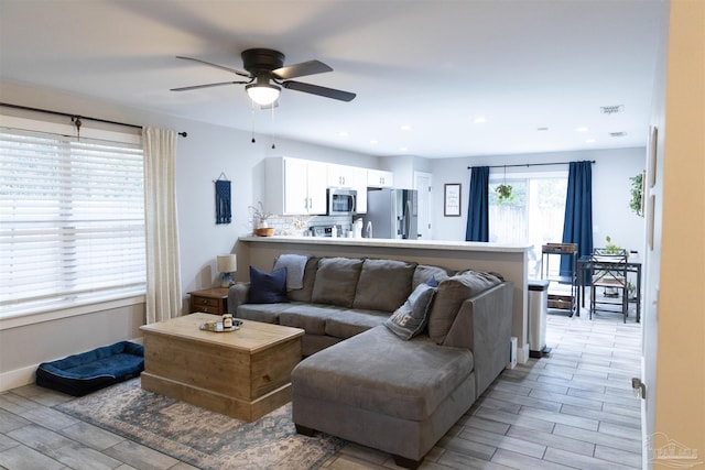 living room featuring ceiling fan