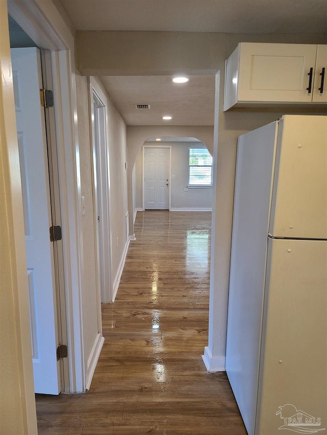 hall with dark hardwood / wood-style floors