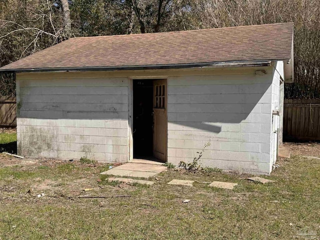 view of outbuilding with an outbuilding and fence