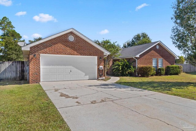 view of front of home with a garage and a front yard