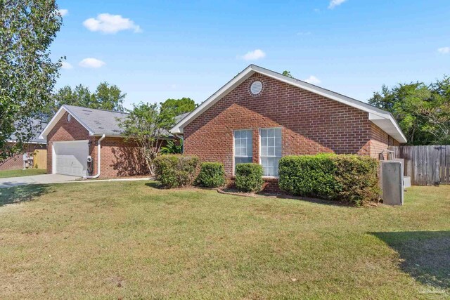 front of property featuring a garage and a front lawn