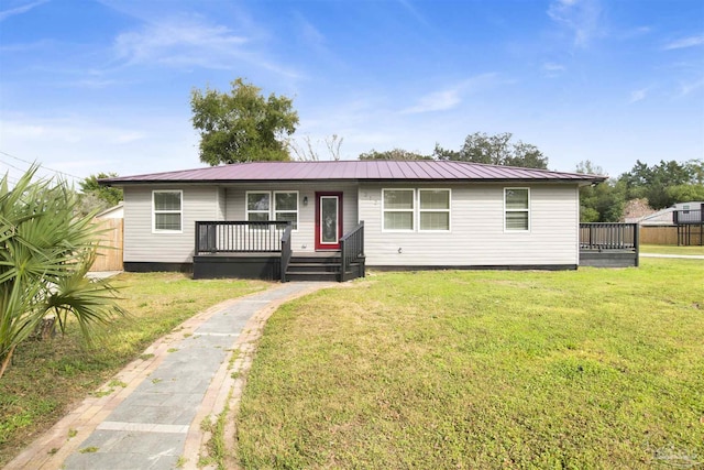 view of front of house featuring a wooden deck and a front yard