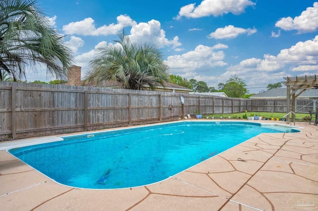 view of swimming pool featuring a fenced in pool, a patio, and a fenced backyard