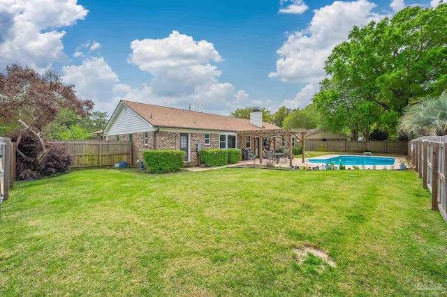 rear view of house featuring a chimney, a pergola, a fenced backyard, a patio area, and a lawn