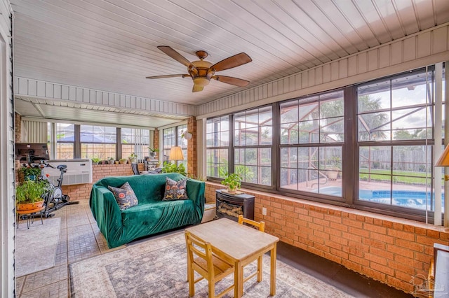 sunroom / solarium with a wealth of natural light and ceiling fan