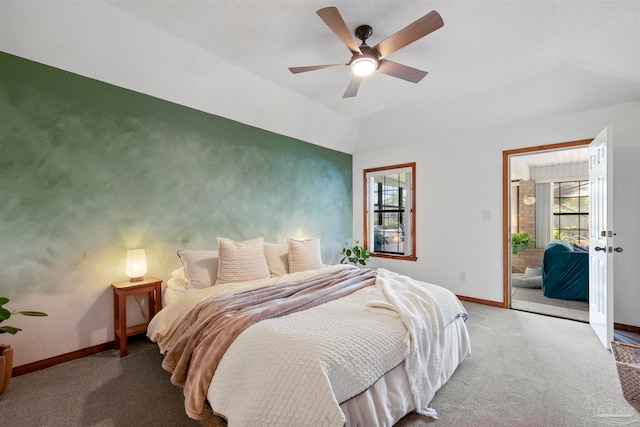 carpeted bedroom featuring ceiling fan and vaulted ceiling