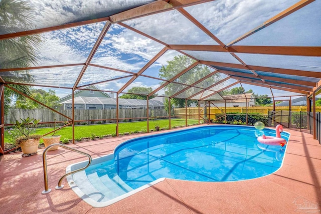 view of swimming pool with a lawn, a patio, and glass enclosure