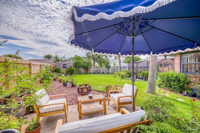 view of patio / terrace with a storage shed