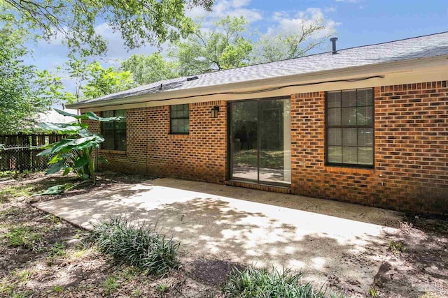 rear view of property featuring a patio