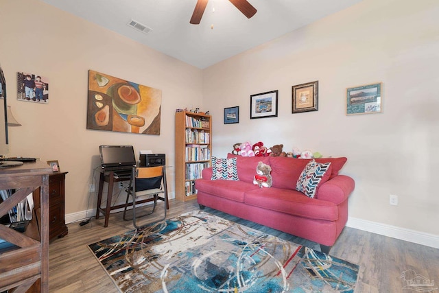3246 Main St, Navarre, FL 32566 - living room featuring visible vents, baseboards, and wood finished floors