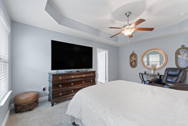 3246 Main St, Navarre, FL 32566 - bedroom featuring ceiling fan, carpet flooring, a raised ceiling, and baseboards