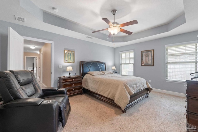 3246 Main St, Navarre, FL 32566 - bedroom featuring light carpet, baseboards, visible vents, and a raised ceiling