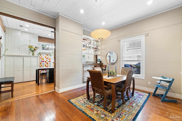 dining room featuring recessed lighting, wood ceiling, baseboards, and hardwood / wood-style floors