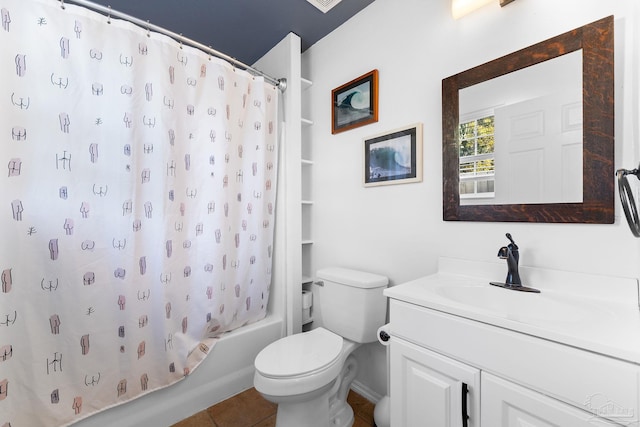 full bath with tile patterned floors, shower / bath combo with shower curtain, toilet, and vanity