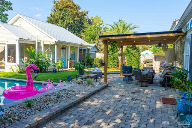 view of patio with a fenced in pool