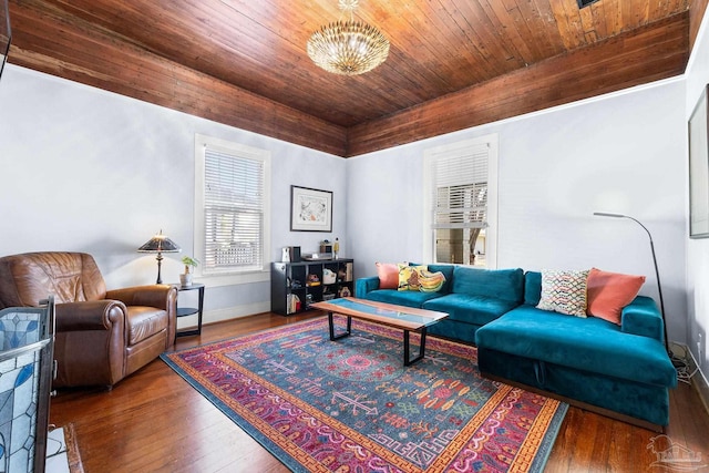 living area featuring an inviting chandelier, wooden ceiling, baseboards, and hardwood / wood-style floors