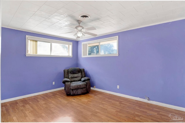 unfurnished room with wood-type flooring and ornamental molding