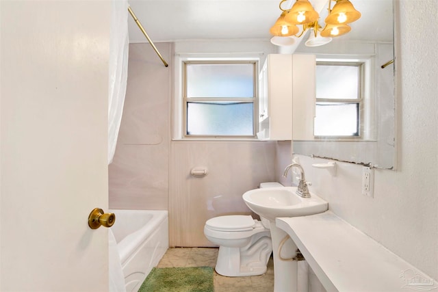 full bathroom with shower / bath combination, toilet, a notable chandelier, and sink