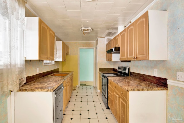 kitchen featuring light brown cabinetry and appliances with stainless steel finishes