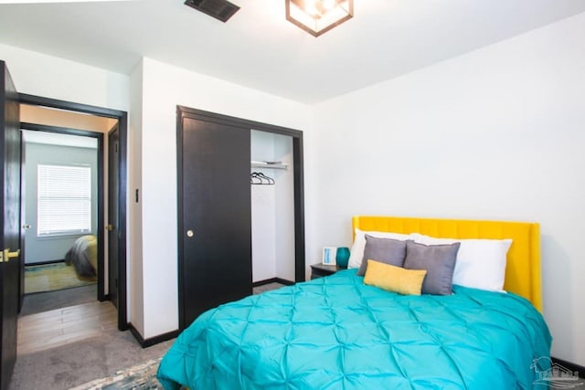 bedroom featuring a closet and carpet flooring