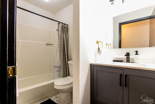 full bathroom featuring toilet, shower / bath combo, and vanity