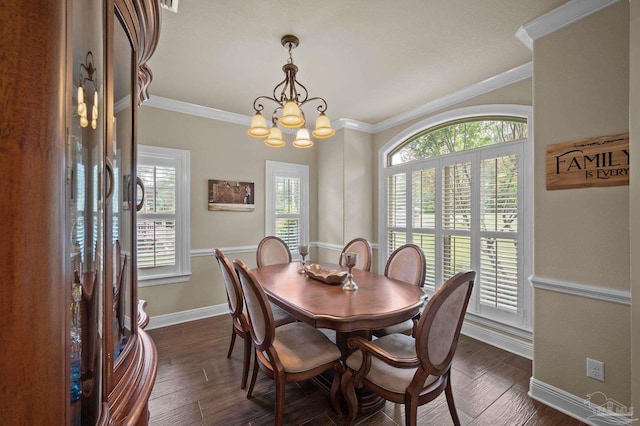 dining room with baseboards, a notable chandelier, dark wood finished floors, and crown molding