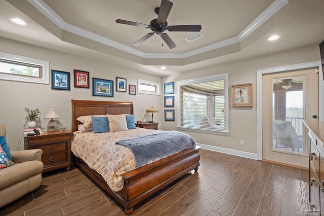 bedroom with dark wood-style floors, access to outside, a tray ceiling, visible vents, and ornamental molding