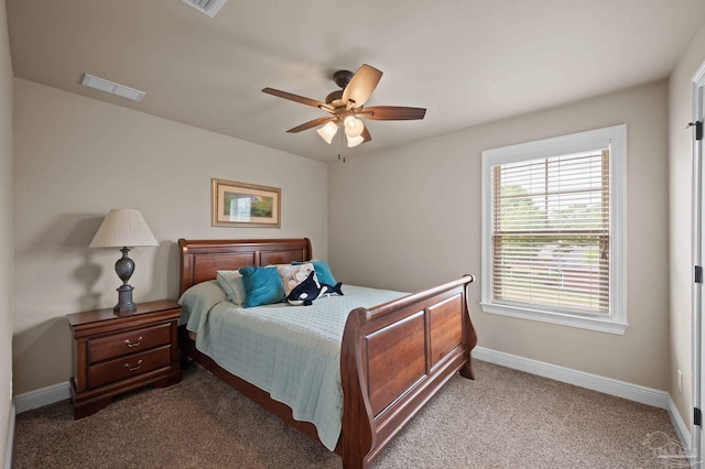 carpeted bedroom with baseboards, visible vents, and ceiling fan