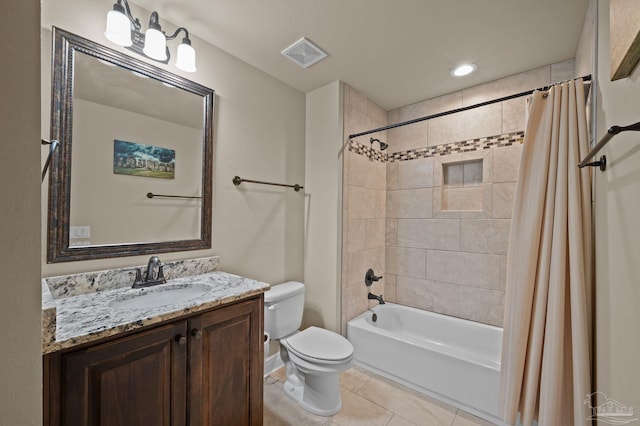 full bathroom with visible vents, toilet, shower / bath combination with curtain, vanity, and tile patterned flooring