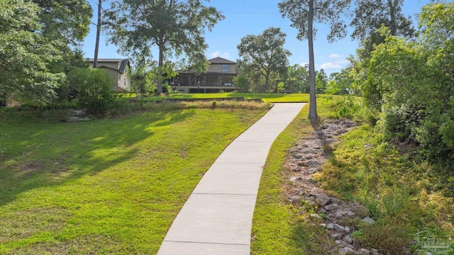 surrounding community featuring a lawn