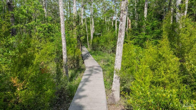 surrounding community featuring a forest view